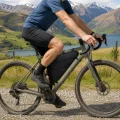 man riding a bike in nz with a frame bag attached to the bicycle