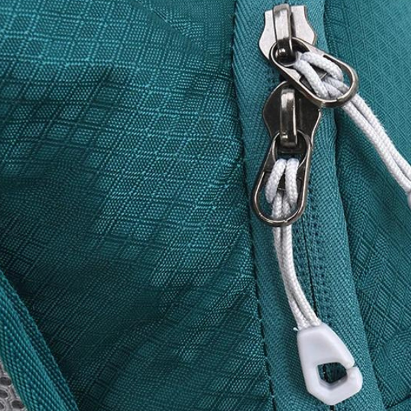 dual zips on side of green water pack bag