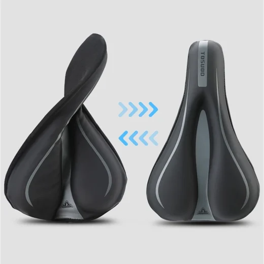 Flexible black gel bike seat cover shown bending beside a bicycle saddle for fitted seat comfort