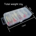 Closed storage box holding gold and silver trout lures, labelled 13 cm by 6 cm with total weight 93 g