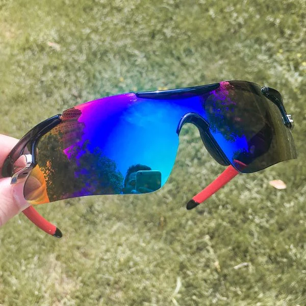 Adsports bicycle sunglasses held in hand