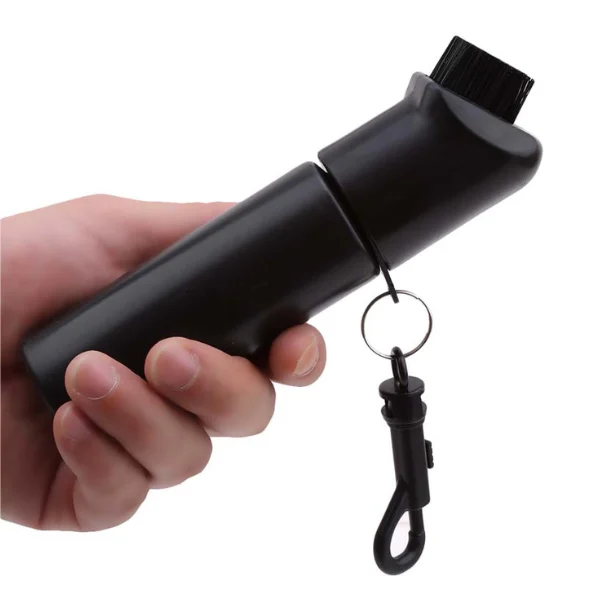 Holding golf head brush in hand