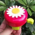 red-kids-bike-bell-held-in-hand