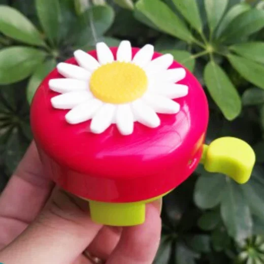 red-kids-bike-bell-held-in-hand