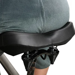person using the extra wide bike saddle from adsports nz