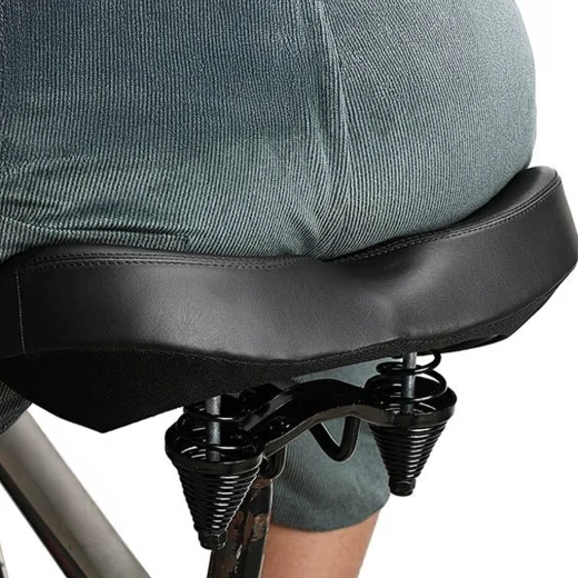person using the extra wide bike saddle from adsports nz