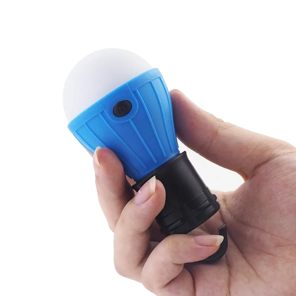 battery power led camping lamp held in hand for size perspective