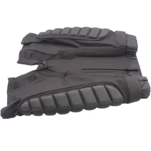 Folded shorts showing ribbed EVA padding blocks along the outer thigh