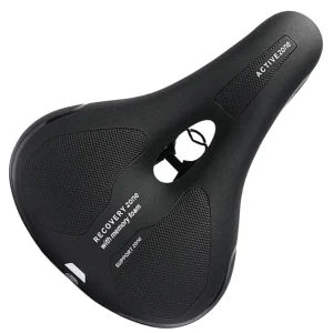 Top view of black wide bicycle saddle with textured padding and ventilation cutout