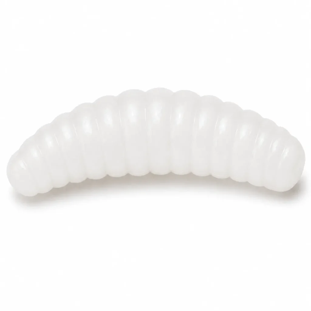 White soft bait grub lure close-up with translucent ribbed body