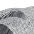 Close-up of grey wrist splint breathable mesh fabric and adjustable strap material