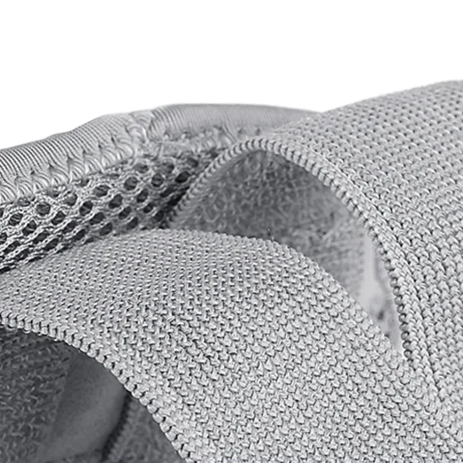 Close-up of grey wrist splint breathable mesh fabric and adjustable strap material