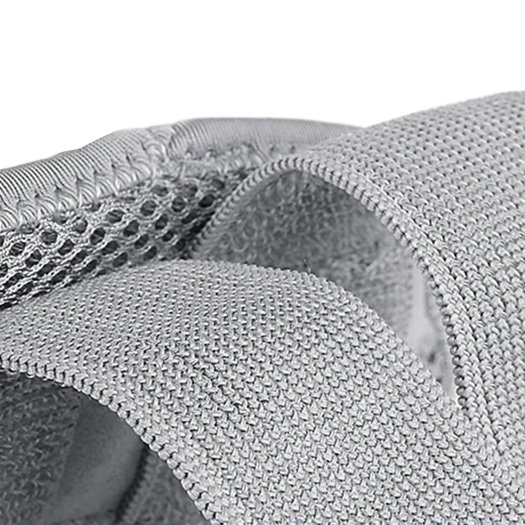 Close-up of grey wrist splint breathable mesh fabric and adjustable strap material