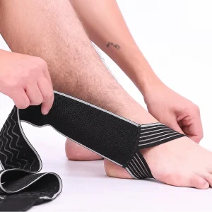 Ankle strap being positioned around the foot before fastening the adjustable wrap