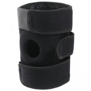 Black adjustable open patella knee brace shown rolled upright with side strap detail