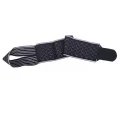 Black and grey ankle strap shown flat with Velcro end and textured grip sections