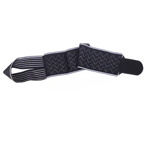 Black and grey ankle strap shown flat with Velcro end and textured grip sections