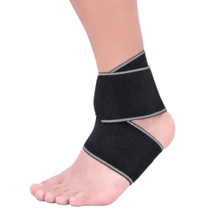 Black and grey ankle strap worn on the ankle with wrap-around support panels visible