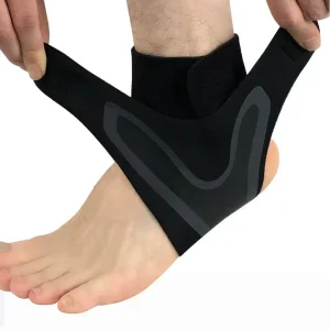 Black and grey ankle support brace being fitted around the left ankle with adjustable side straps