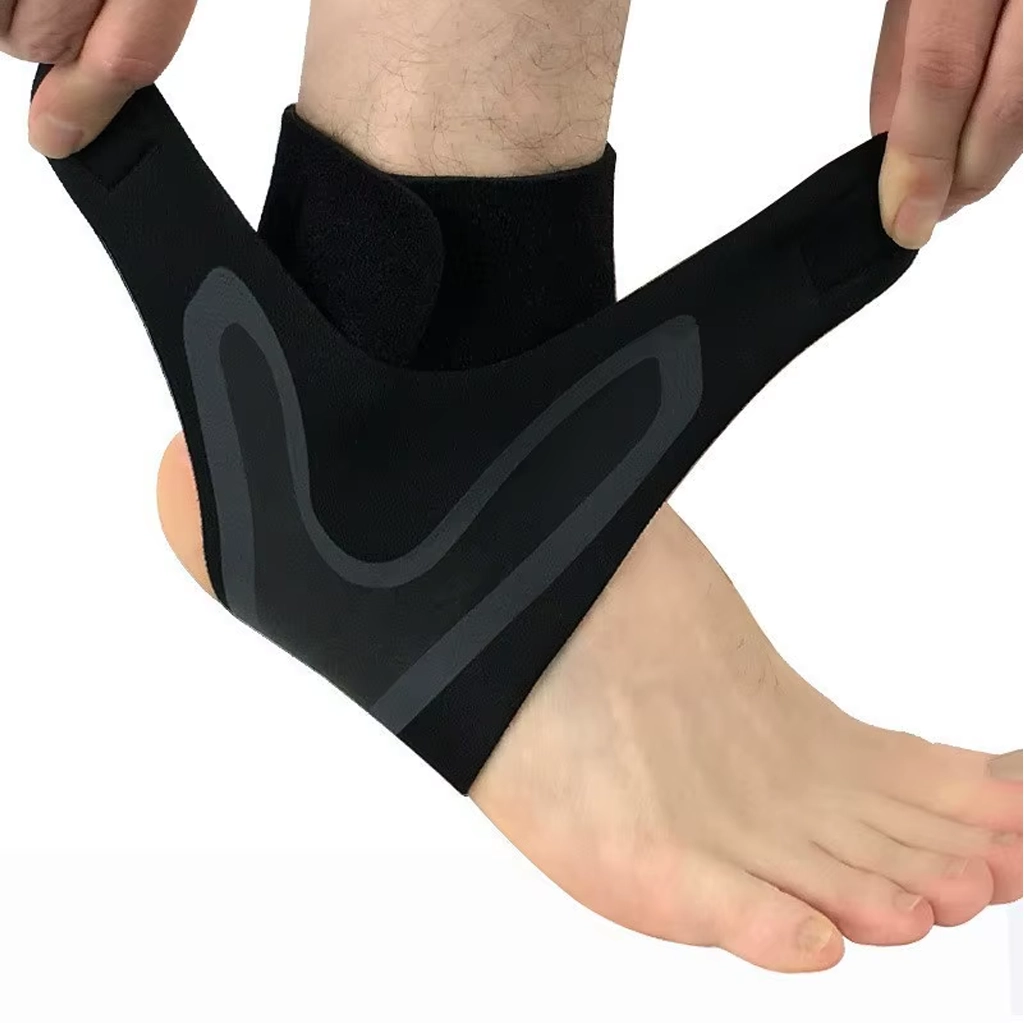 Black and grey ankle support brace being fitted around the right ankle with adjustable side straps