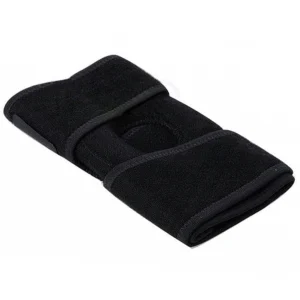Black knee support brace laid flat showing the wraparound shape and Velcro strap areas