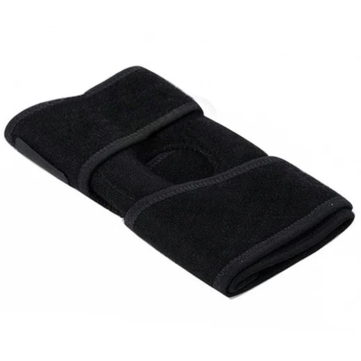 Black knee support brace laid flat showing the wraparound shape and Velcro strap areas