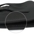 Close-up of the black knee support brace fabric and stitched edge detail