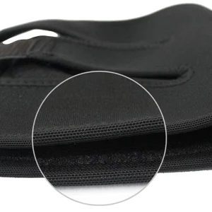Close-up of the black knee support brace fabric and stitched edge detail
