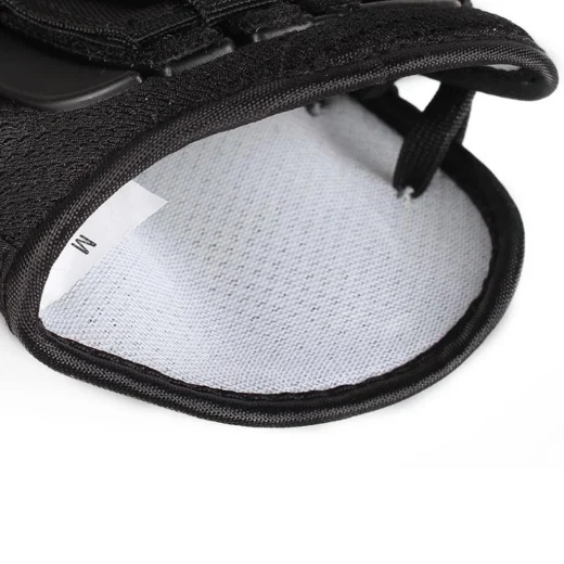 Close-up of the inside padding and size M label on the ankle strap support brace
