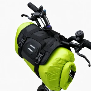 Green bike handlebar bag with roll top dry bag closure and black mounting harness