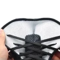 Inside view of ankle strap support showing light coloured breathable lining and lace-up front