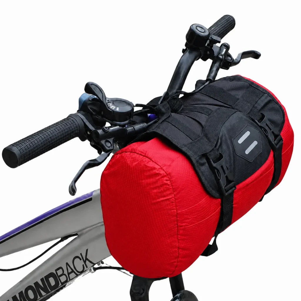 Red handlebar bag 10L mounted on mountain bike front bars