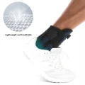Black and blue ankle brace worn inside a white sports shoe