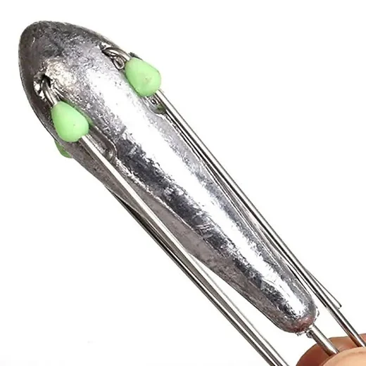 Close-up of a Suckerme 4oz breakaway sinker body with green glow beads and folded wire spikes