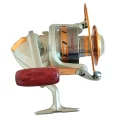 EF9000 surf casting reel side view with silver body, gold spool trim and red-brown handle grip
