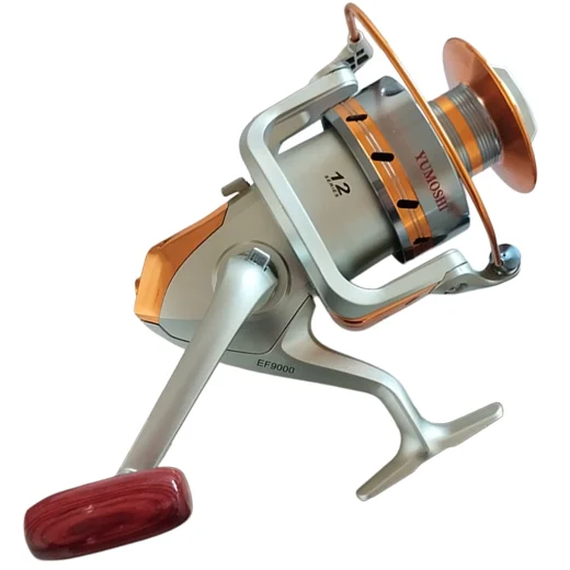 EF9000 surfcasting reel shown from the handle side with red-brown handle grip and silver-gold body