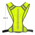 Fluorescent yellow hi vis vest laid flat showing its 45 cm length, reflective back markings and adjustable waist straps