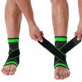 Person adjusting the crossover straps on black and green ankle supports