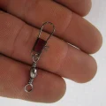 snap swivel connector held on top of hand