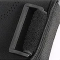 Close-up of the black strap guide buckle on the hinged knee brace