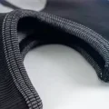 Close view of the stretch knitted edging and construction of the balaclava mask