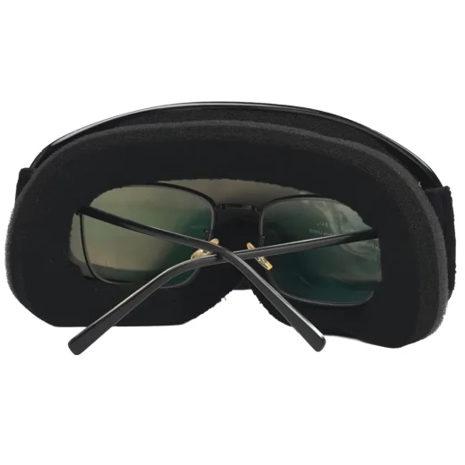 Rear view of childrens ski goggles showing prescription glasses positioned inside the OTG frame