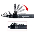 Close-up of the PHISHGER telescopic surfcasting rod showing the folding guide arrangement near the upper sections