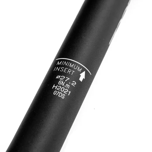 Black 27.2mm seatpost showing the minimum insertion marking